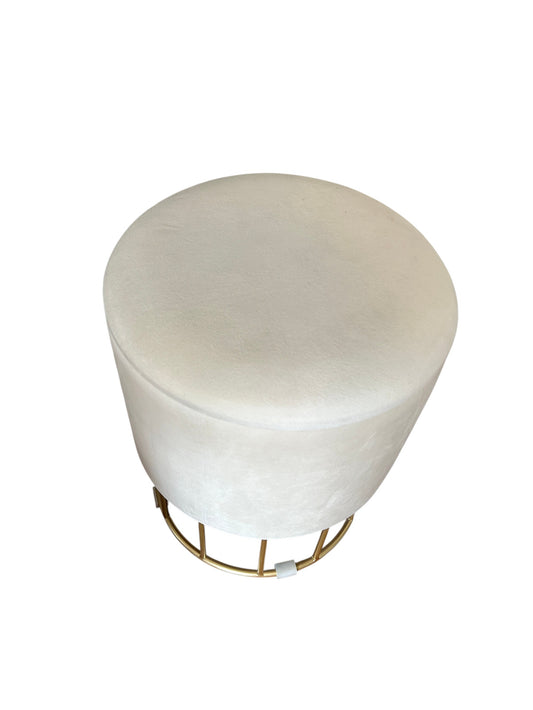 Round velvet storage ottoman with gold metal wire base.