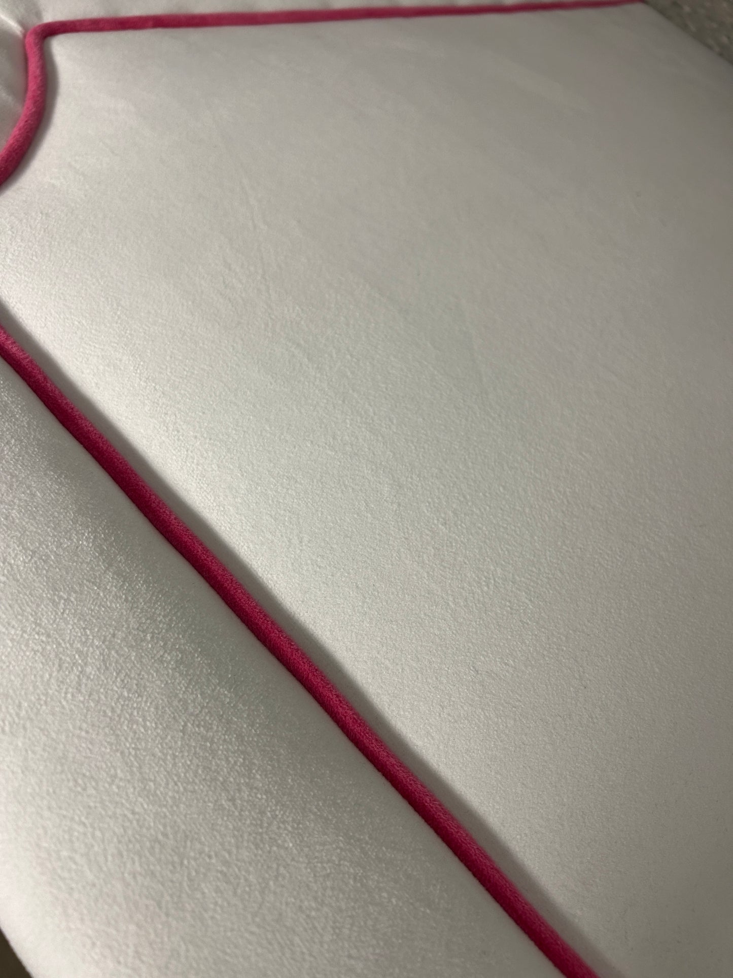 White Dorm Decor twin headboard with hot pink piping.