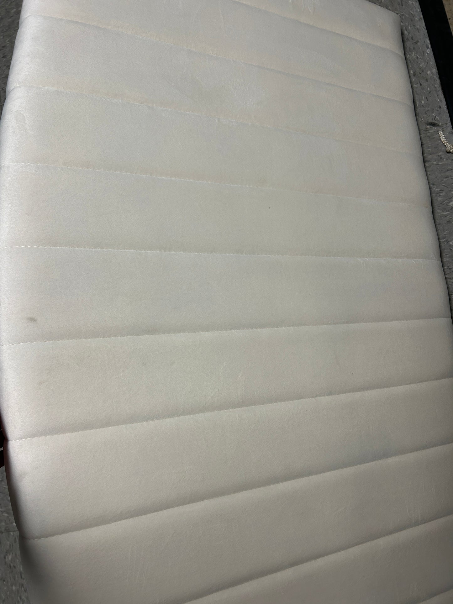 Cream velvet twin headboard.