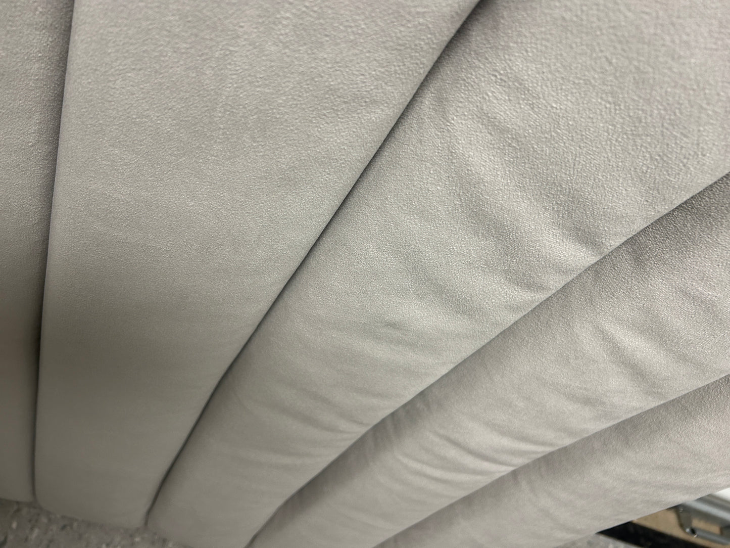 Gray velvet twin headboard with charging port.