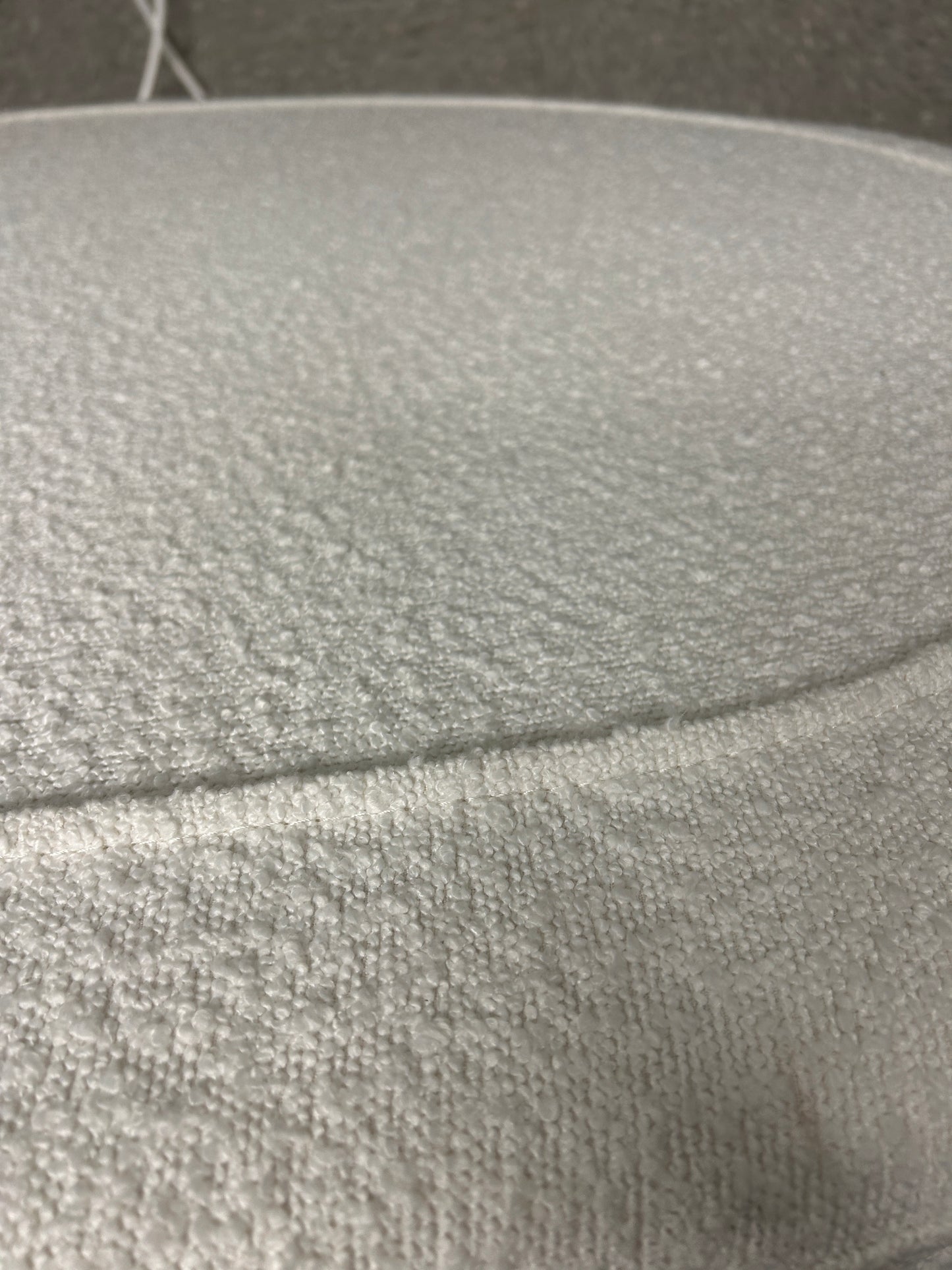 Dormify white twin headboard with bouclé fabric and a charging outlet.