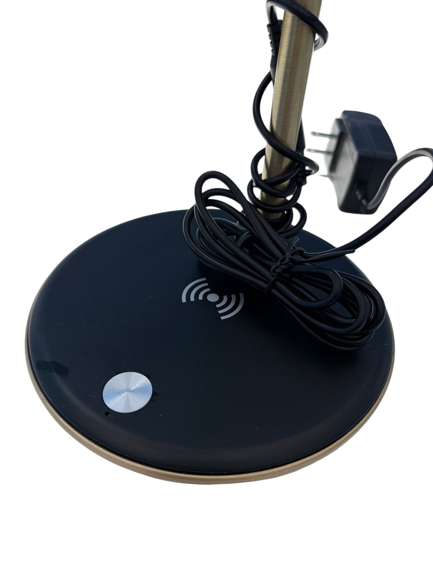 Gold desk lamp with wireless charger.
