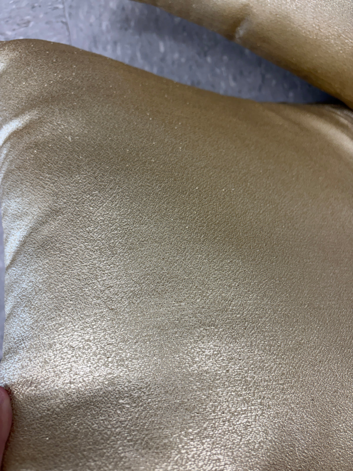 Set of 2 gold throw pillows.