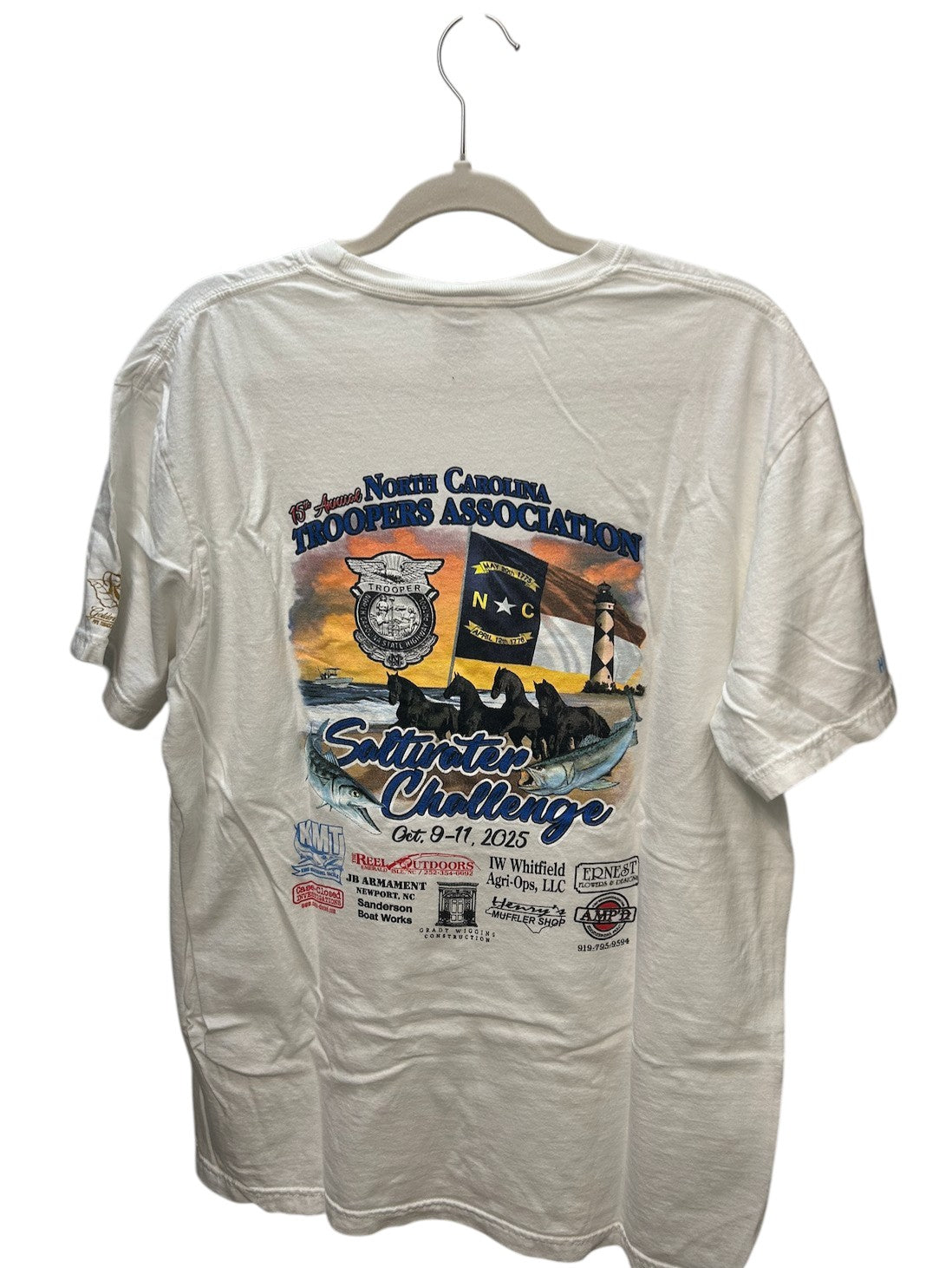 White short-sleeve t-shirt featuring the 15th Annual North Carolina Troopers Association Saltwater Challenge event graphic from October 2025.