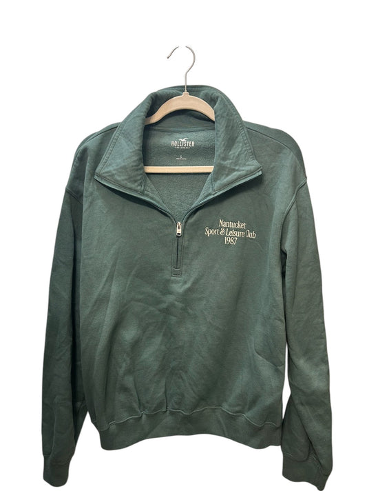 Sage green Hollister quarter-zip pullover sweatshirt with 'Nantucket Sport & Leisure Club 1987' embroidered graphic.