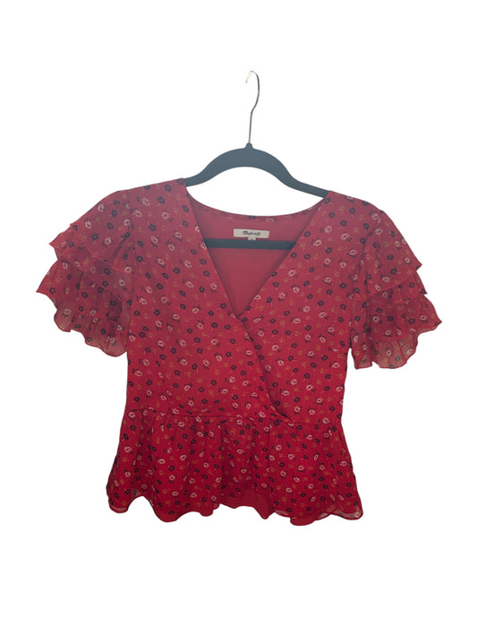 Madewell red floral wrap-style blouse with ruffled flutter sleeves and peplum hem.
