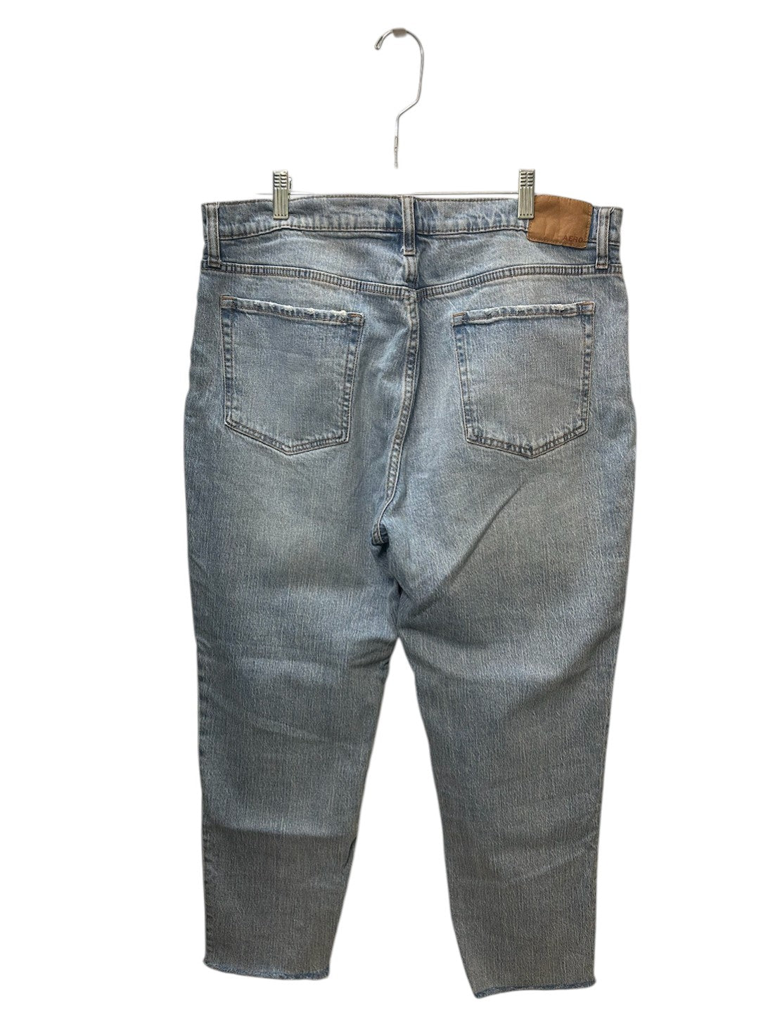 Light wash Aeropostale jeans with raw hem detail and relaxed fit.