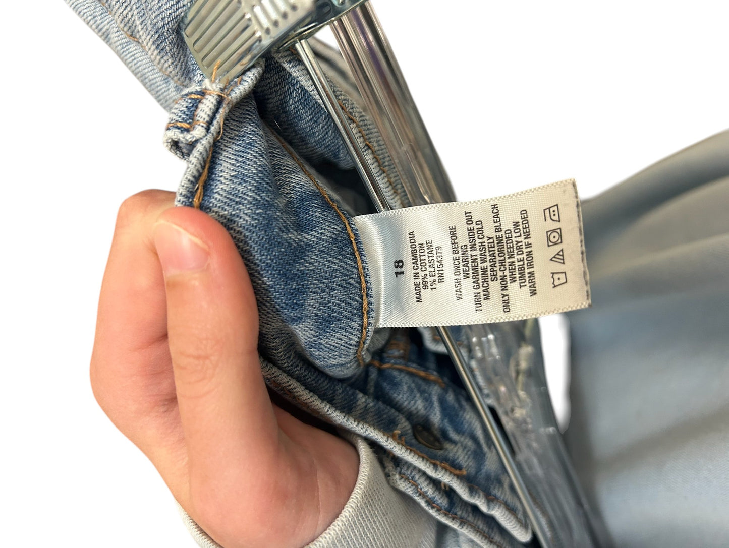 Light wash Aeropostale jeans with raw hem detail and relaxed fit.