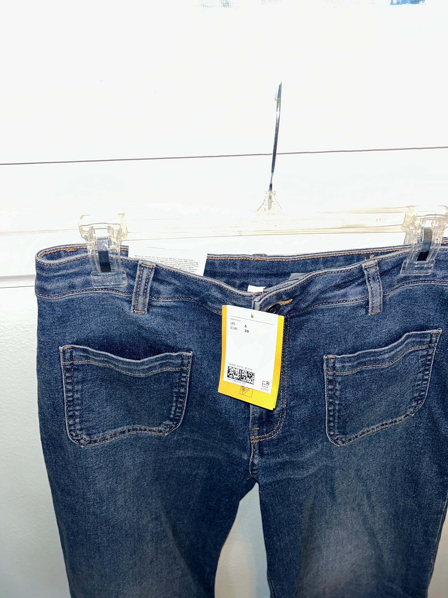 H&M wide-leg denim jeans with front patch pockets, new with tags attached.