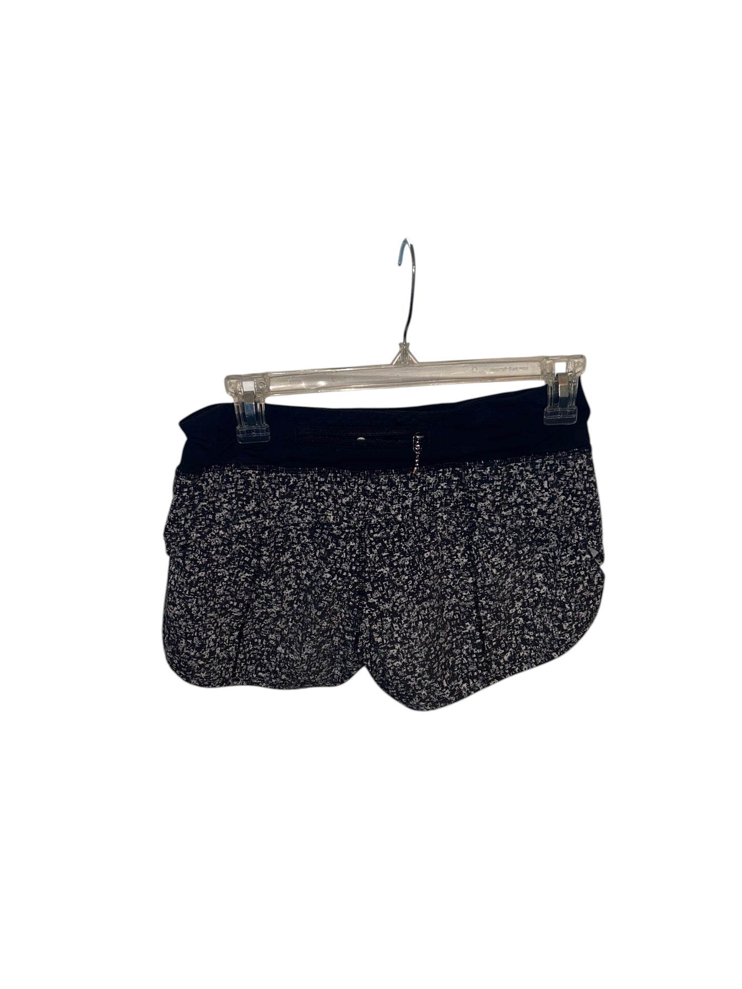 Lululemon Speed Up black and white speckled athletic running shorts with built-in liner and wide waistband.