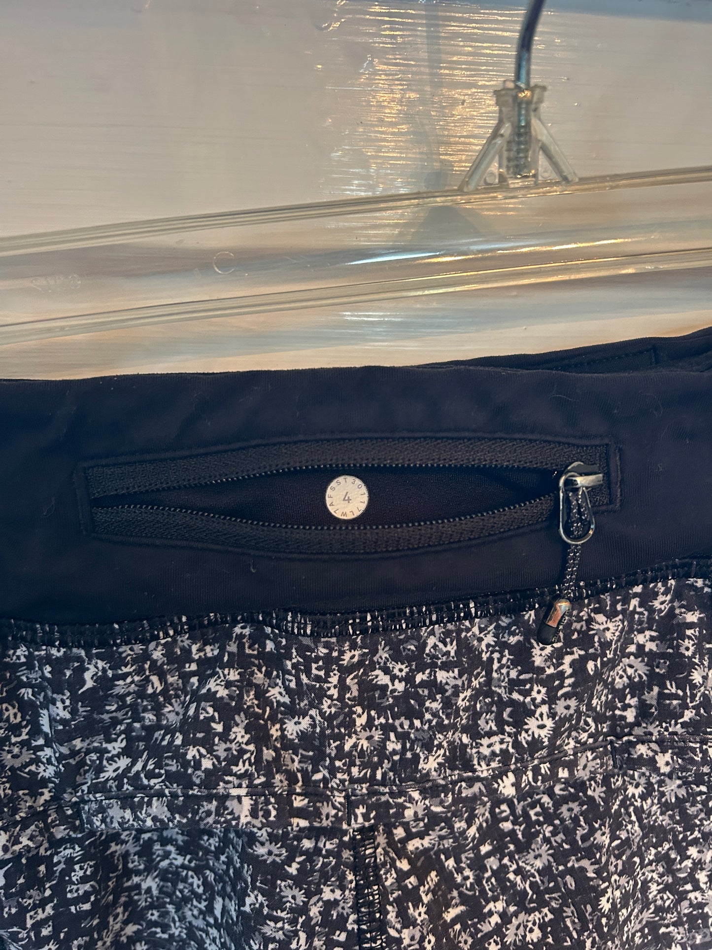 Lululemon Speed Up black and white speckled athletic running shorts with built-in liner and wide waistband.