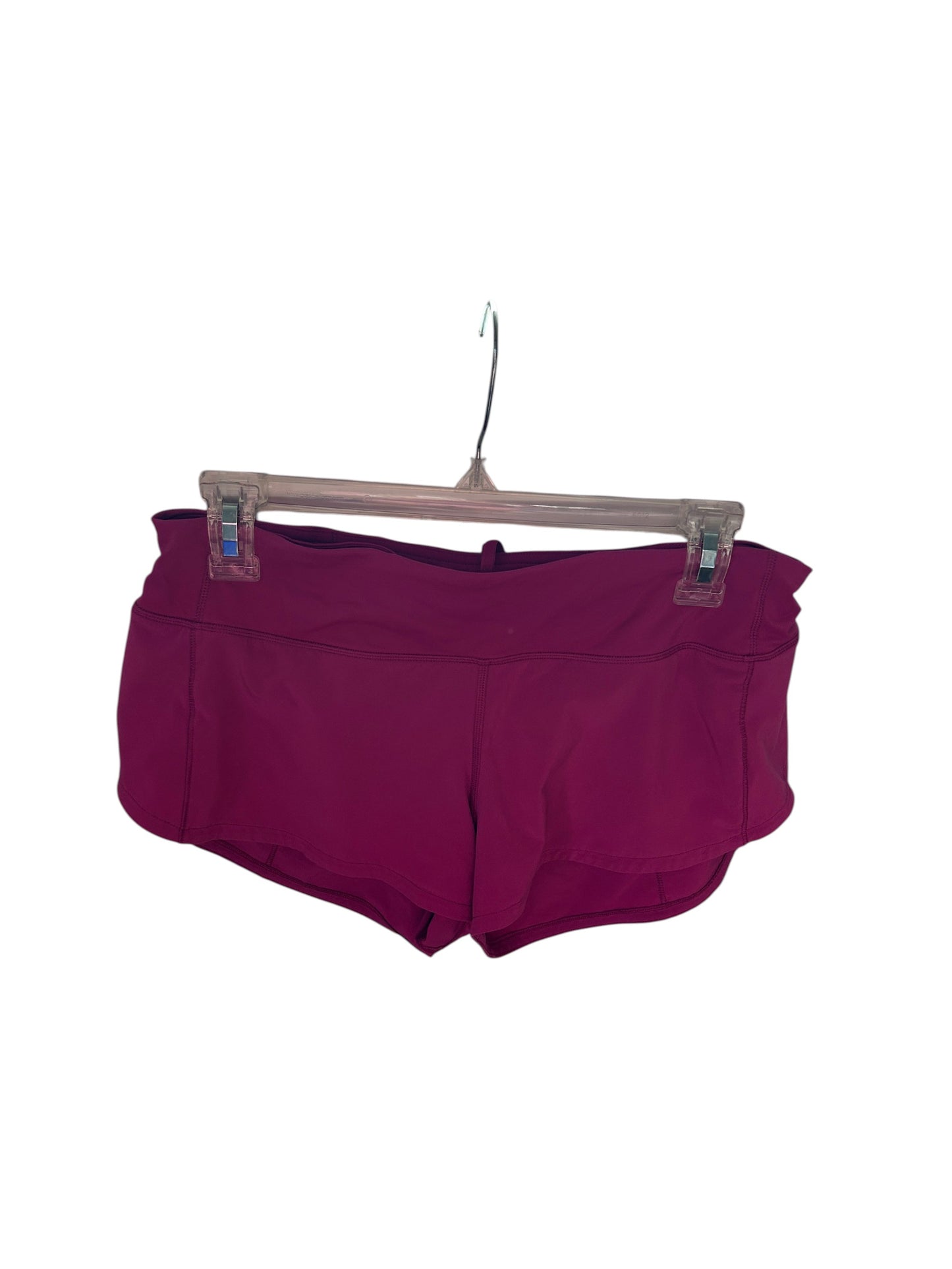 Lululemon magenta athletic running shorts with built-in liner and wide waistband.