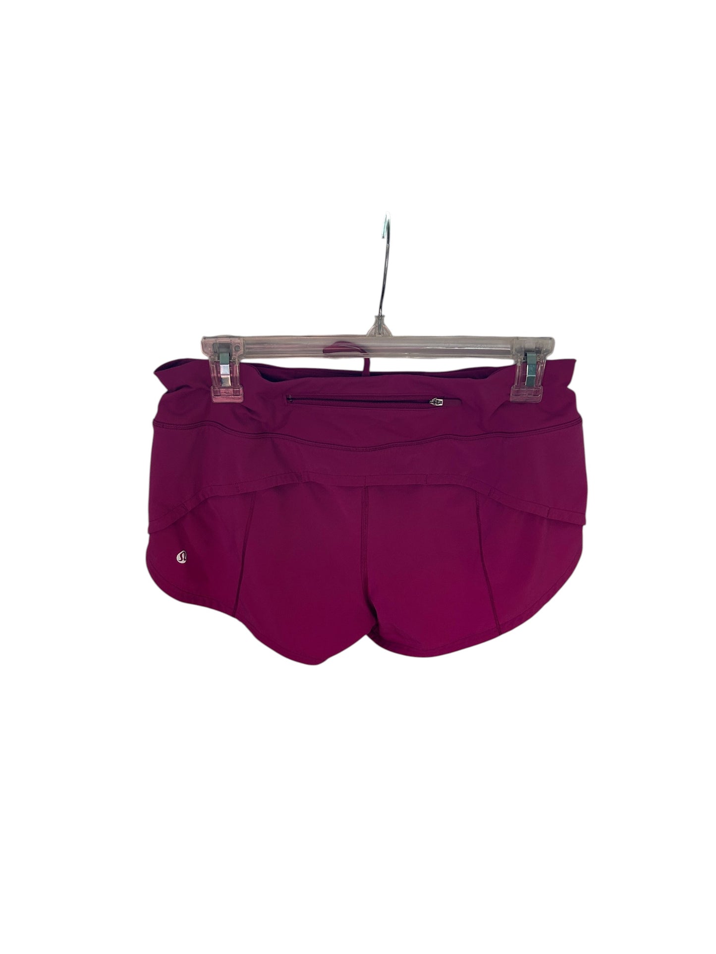 Lululemon magenta athletic running shorts with built-in liner and wide waistband.