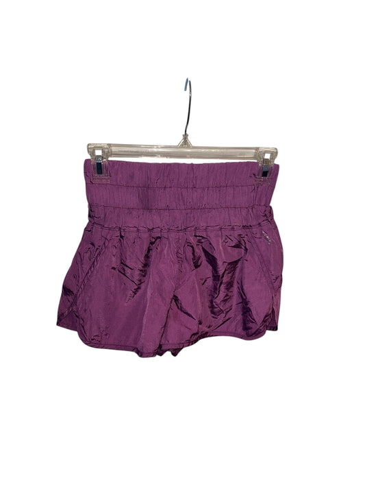 Free People purple athletic shorts with smocked elastic waistband and lightweight crinkled fabric.