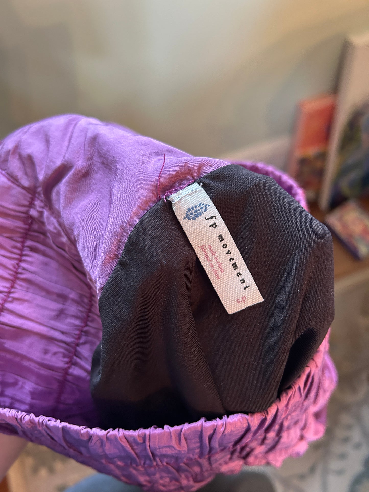 Free People purple athletic shorts with smocked elastic waistband and lightweight crinkled fabric.