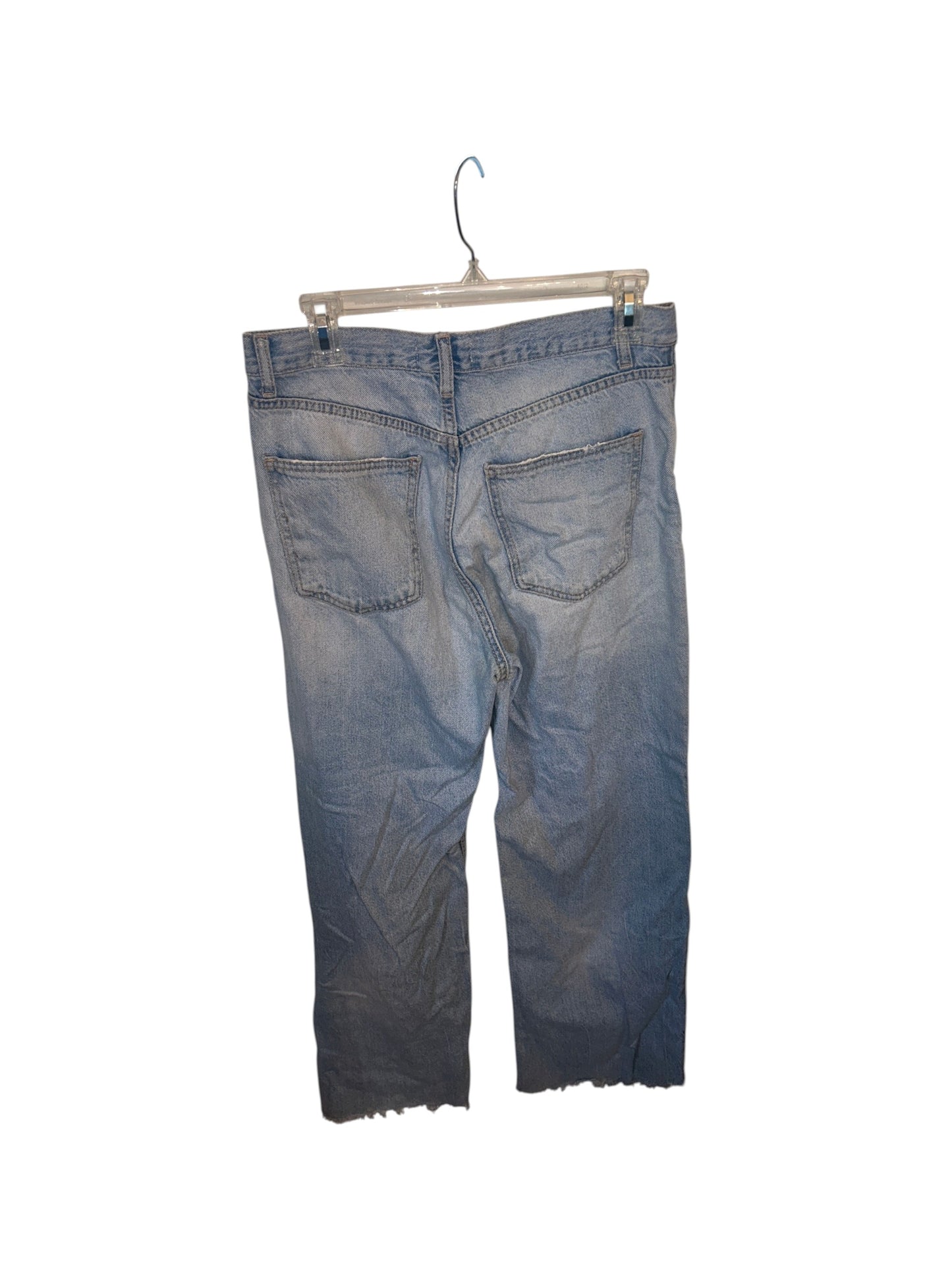 Zara light wash denim jeans with raw hem detailing and a relaxed straight leg fit.