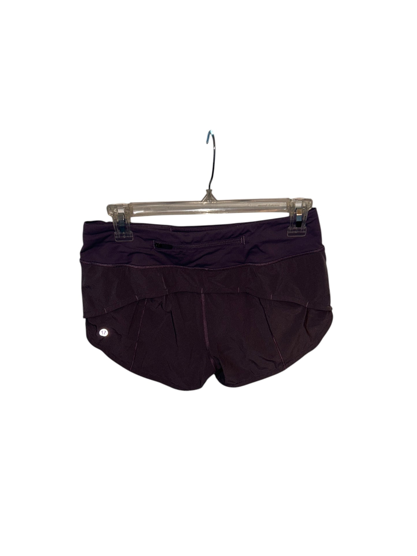 Lululemon purple athletic running shorts with a wide waistband and built-in liner.