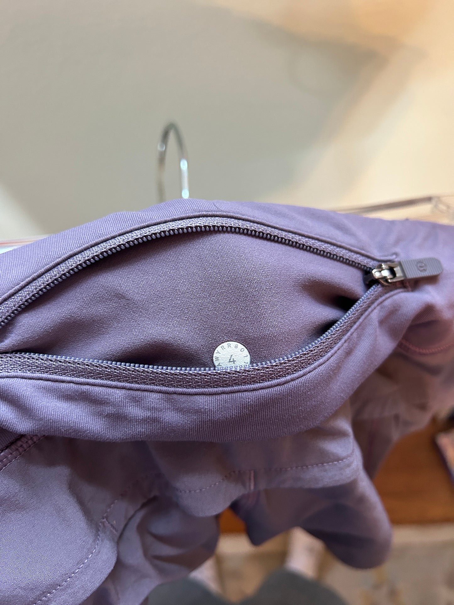 Lululemon purple athletic running shorts with a wide waistband and built-in liner.