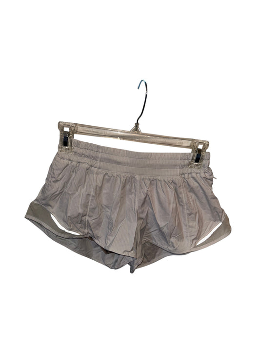 Lululemon white lightweight athletic running shorts with built-in liner and side cutout details.
