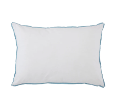 Room 422 white rectangular bed pillow with light blue piping trim along the edges.