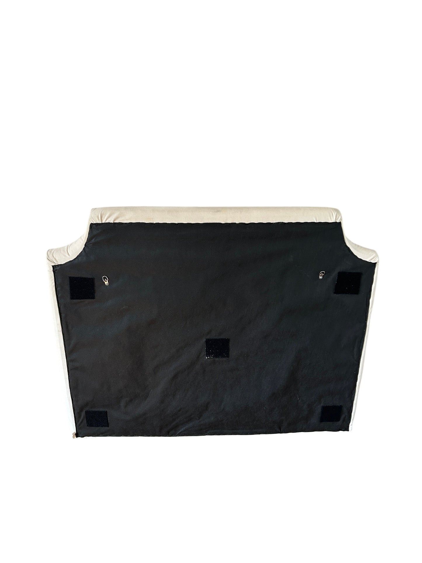 Cream upholstered headboard with curved camelback silhouette.