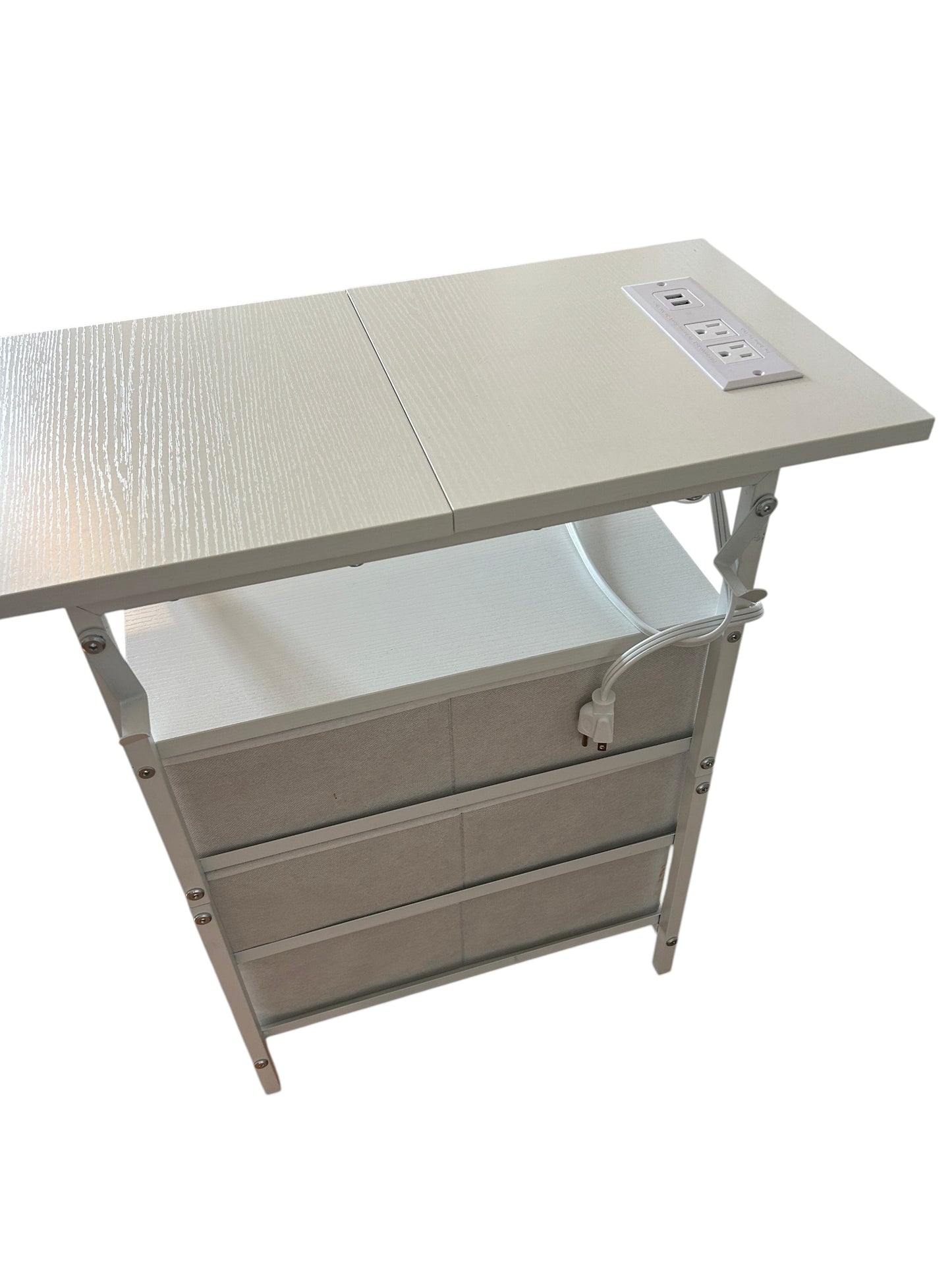 Compact white nightstand with three fabric drawers and gold knobs, featuring an open shelf and metal frame.