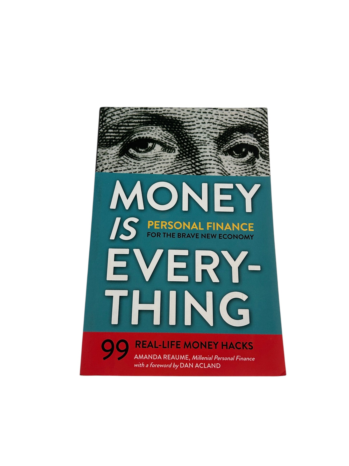 Personal finance book titled 'Money Is Everything: 99 Real-Life Money Hacks' by Amanda Reaume.