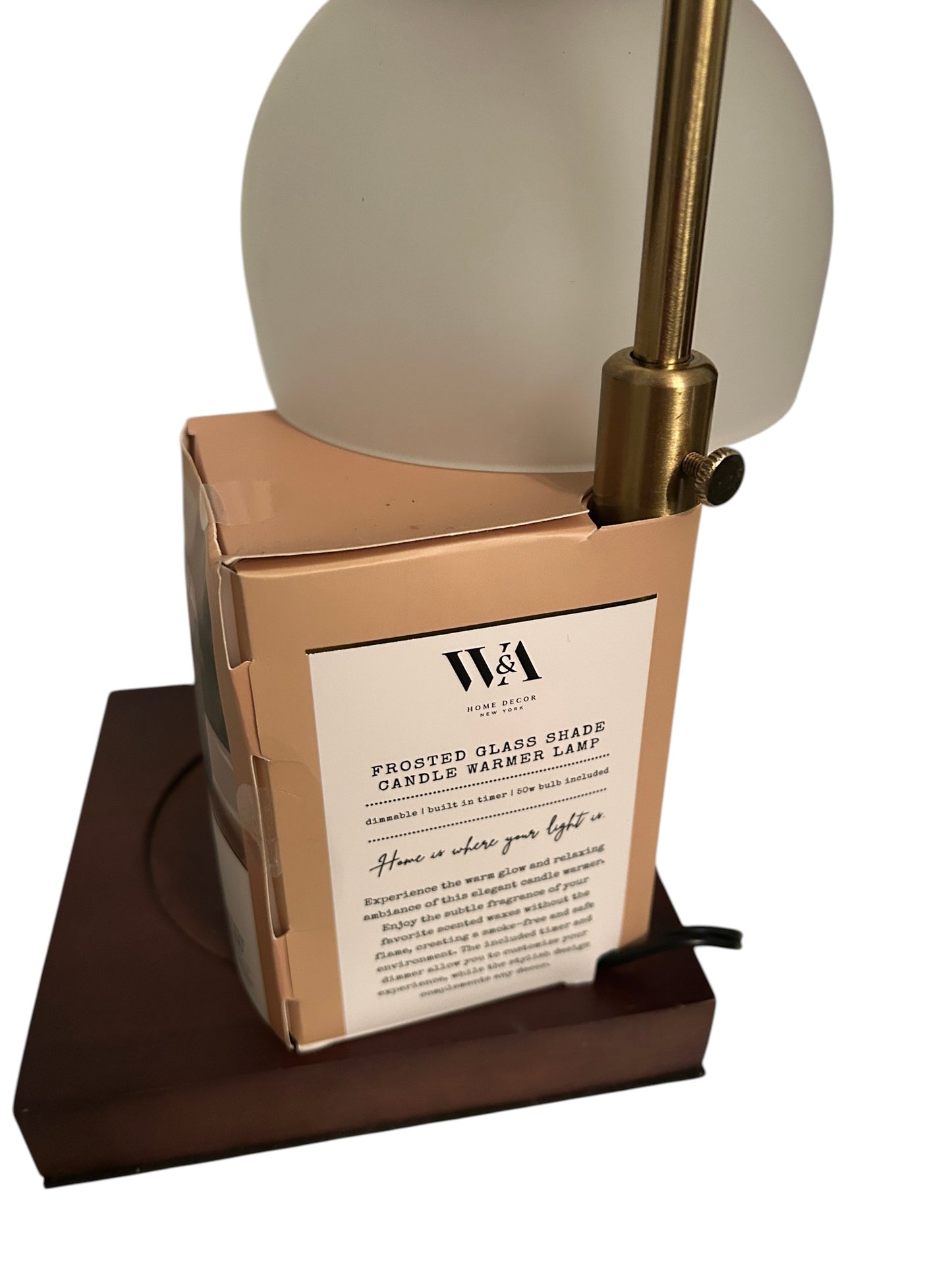 Frosted glass shade candle warmer lamp with brass arm and wooden base.