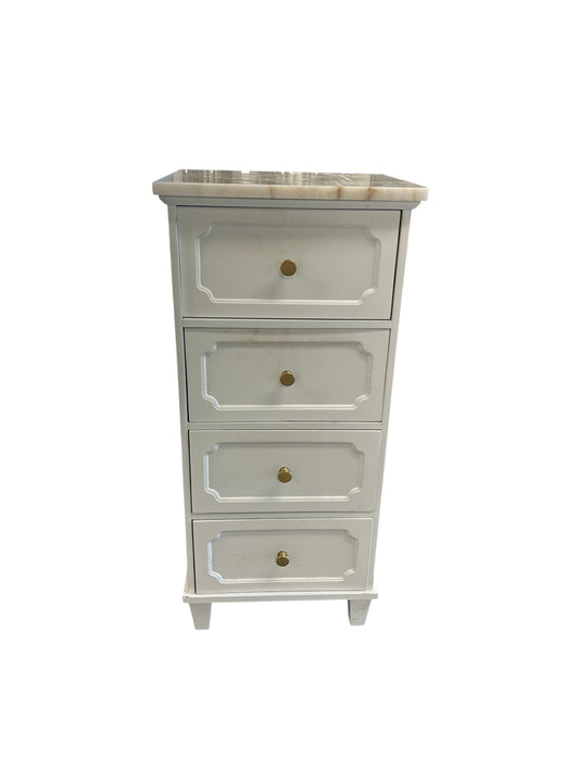 White four-drawer chest with decorative panel fronts, gold knobs, and a marble top.