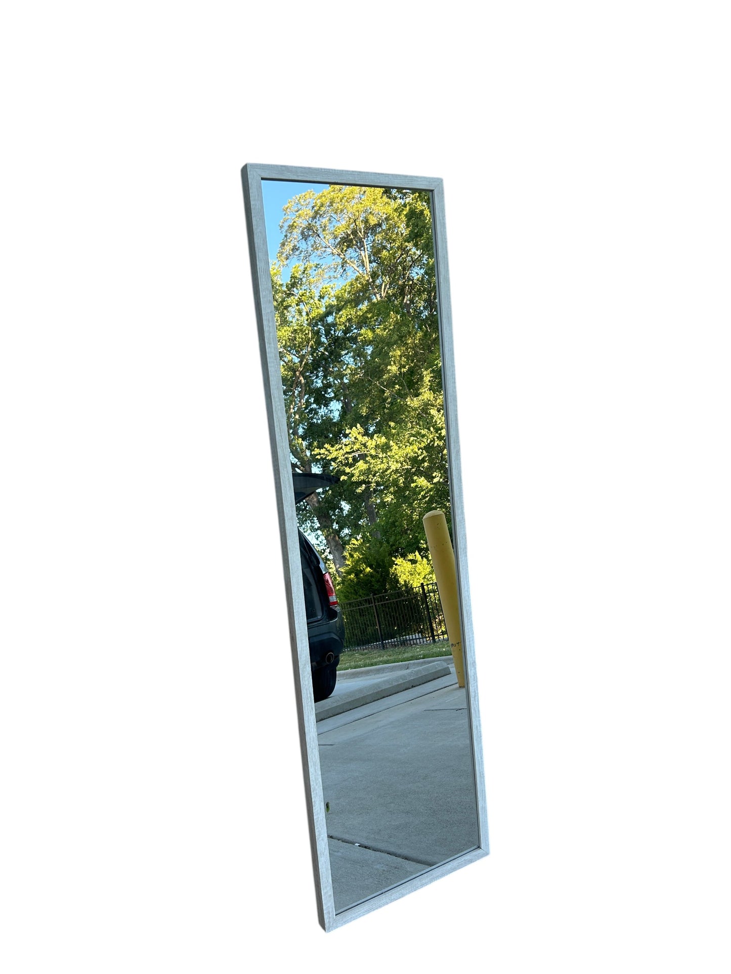 Full-length standing floor mirror with a slim light wooden frame.