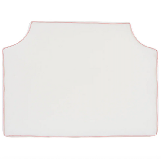 Room 422 twin white headboard with light pink piping trim along edges.