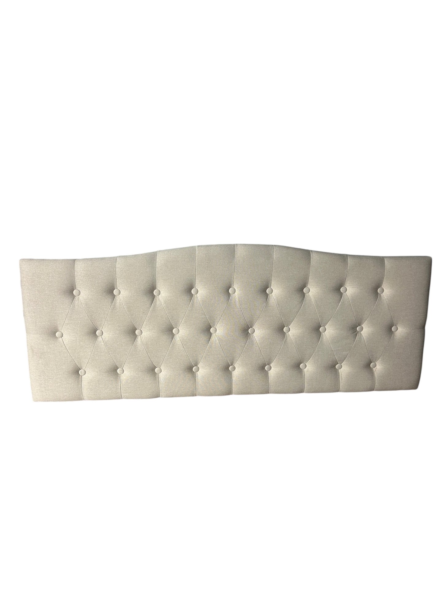 Cream full/queen upholstered tufted headboard with diamond button pattern.