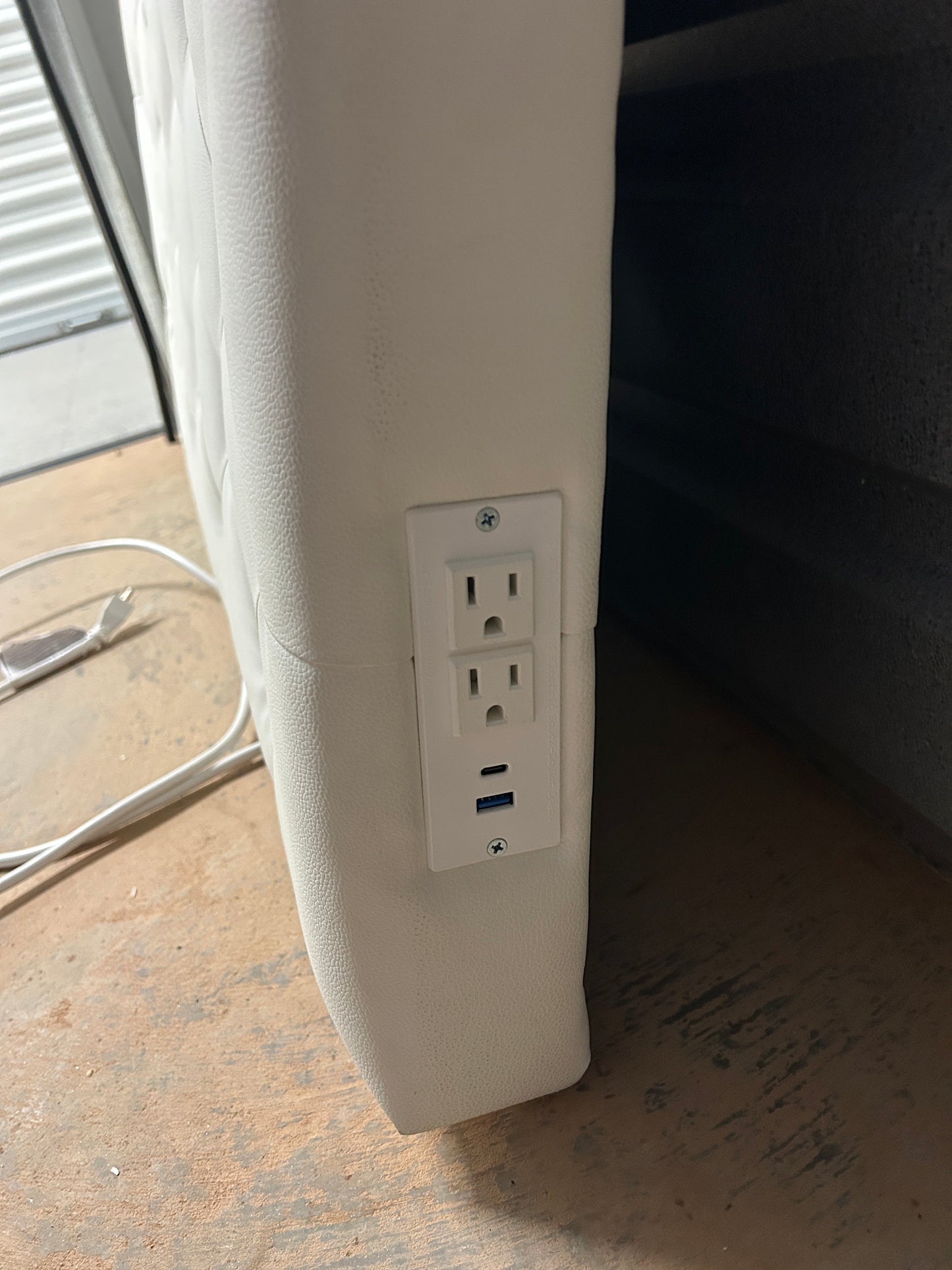 Dormify white twin headboard with faux leather and a charging outlet.