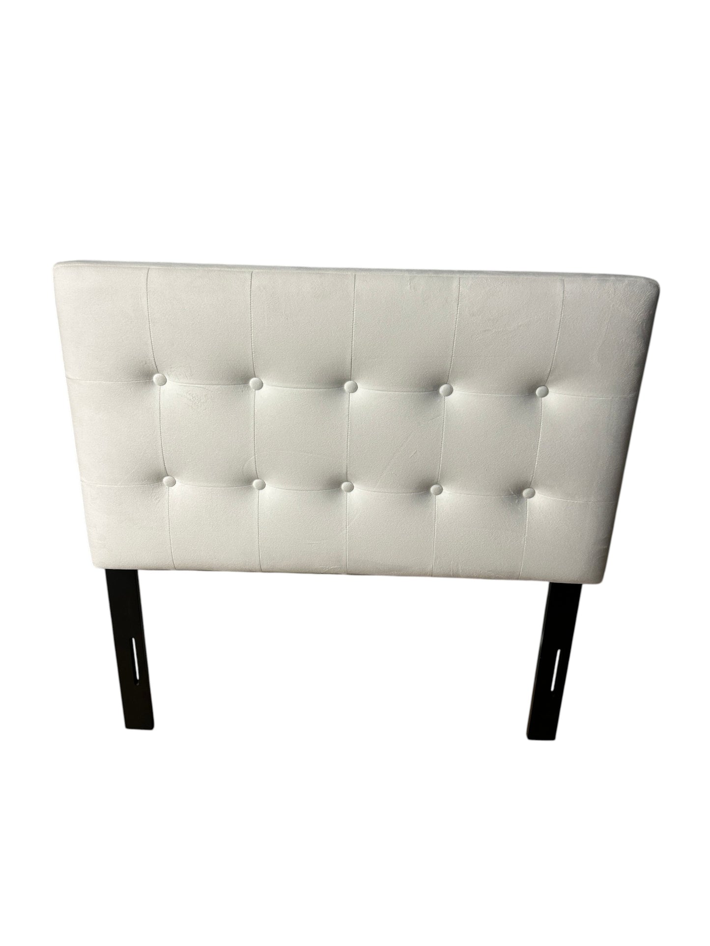 White twin velvet headboard with black metal legs.