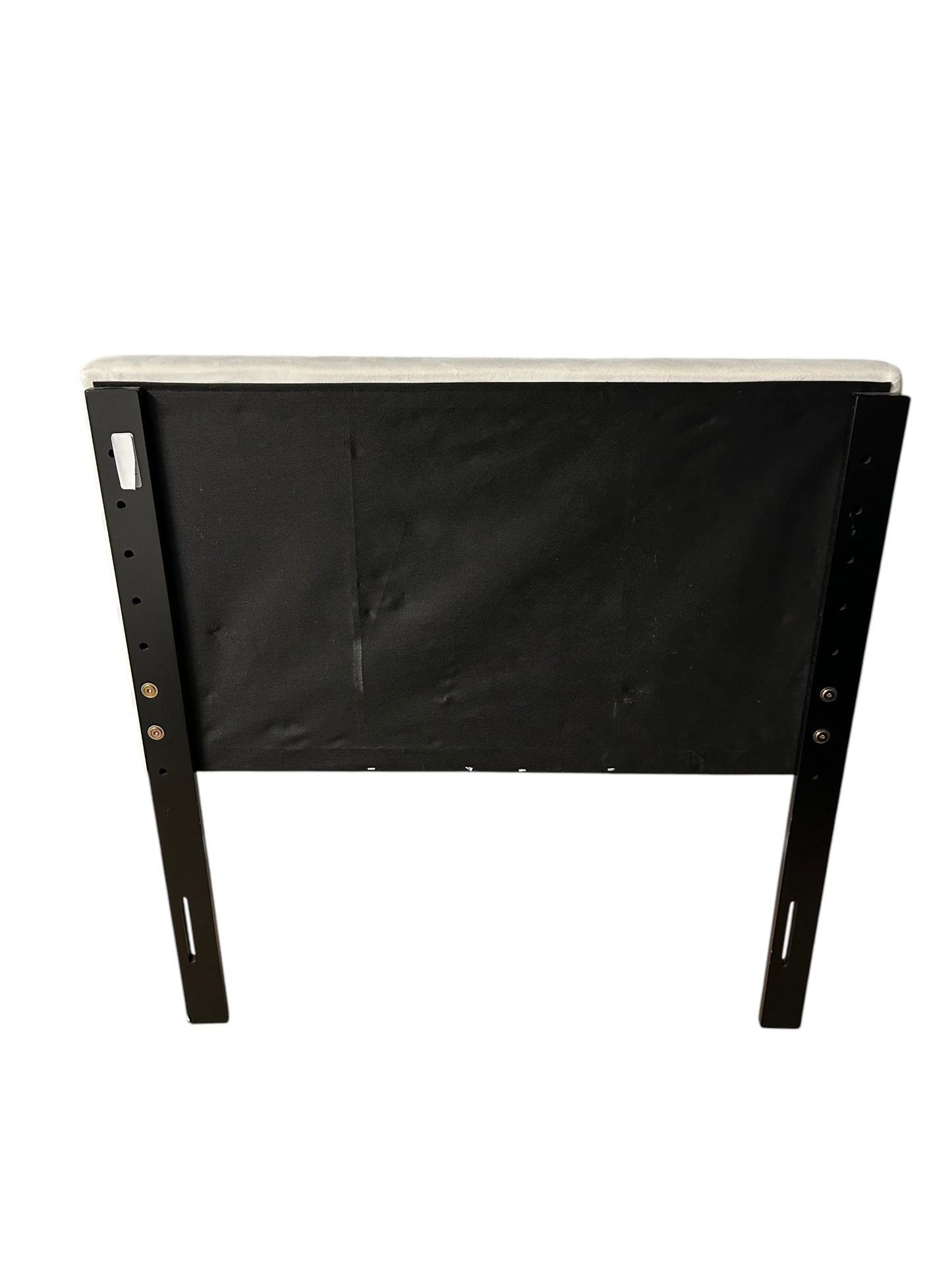 White twin velvet headboard with black metal legs.