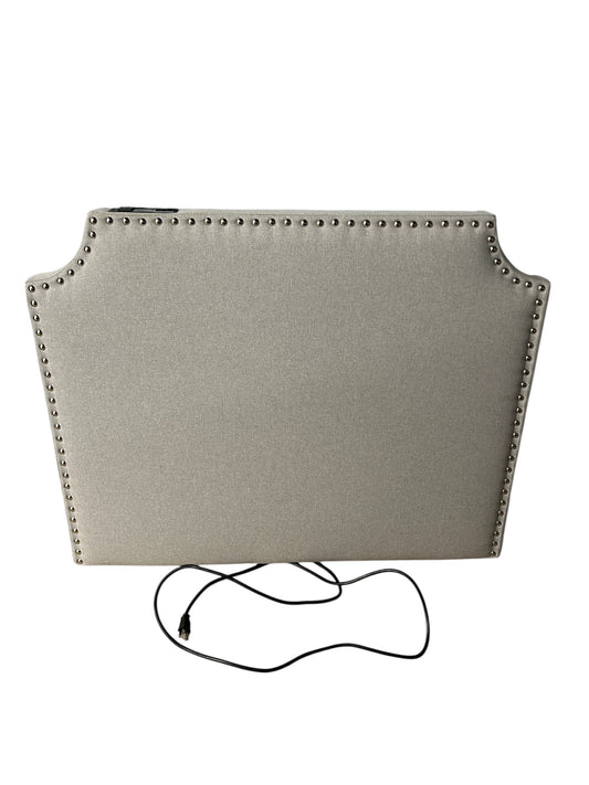 Gray twin headboard with silver buttons and a charging outlet.