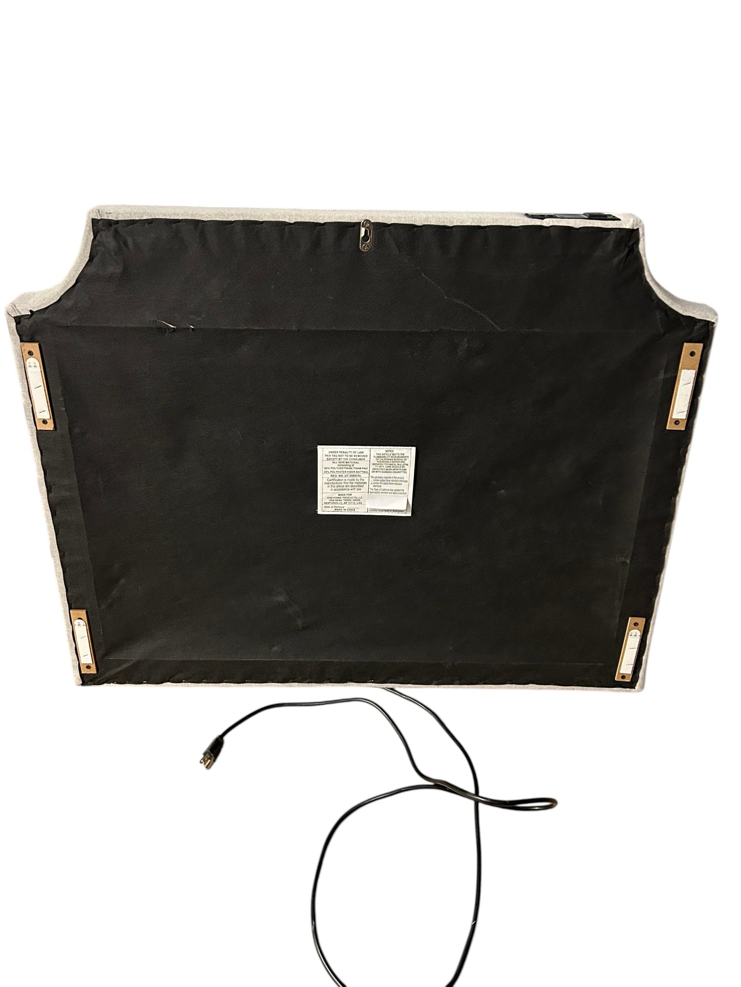 Gray twin headboard with silver buttons and a charging outlet.