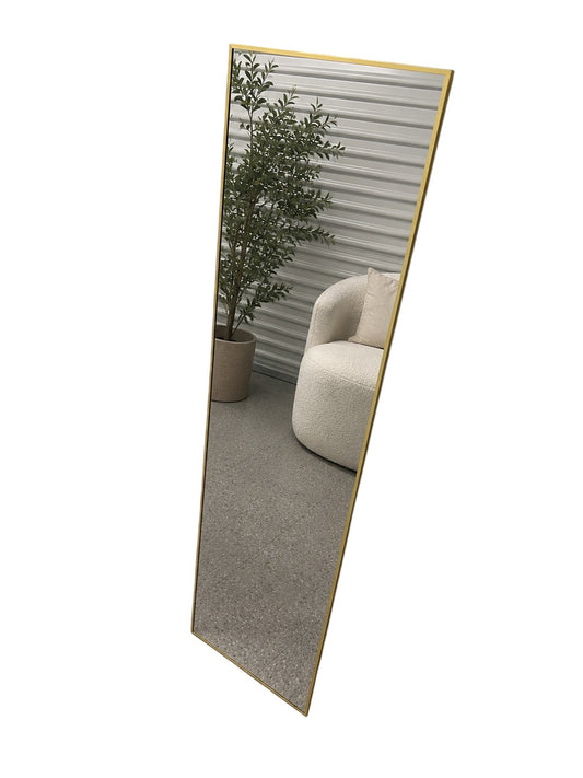 Full-length floor gold mirror with stand.