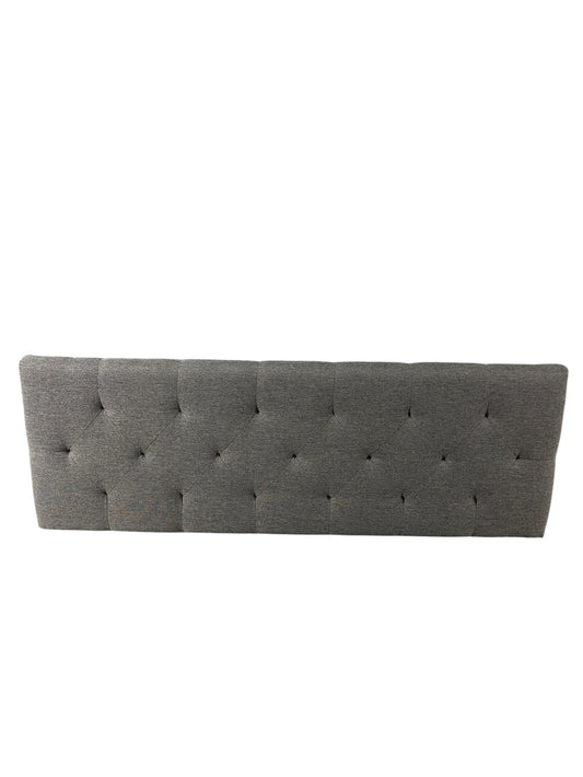 Gray queen upholstered tufted headboard with diamond button pattern.
