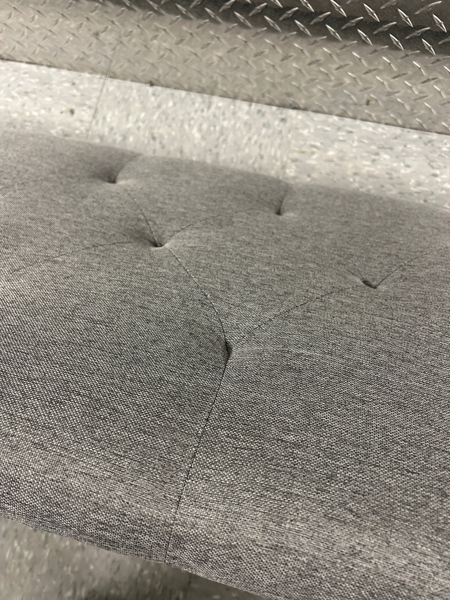 Gray queen upholstered tufted headboard with diamond button pattern.