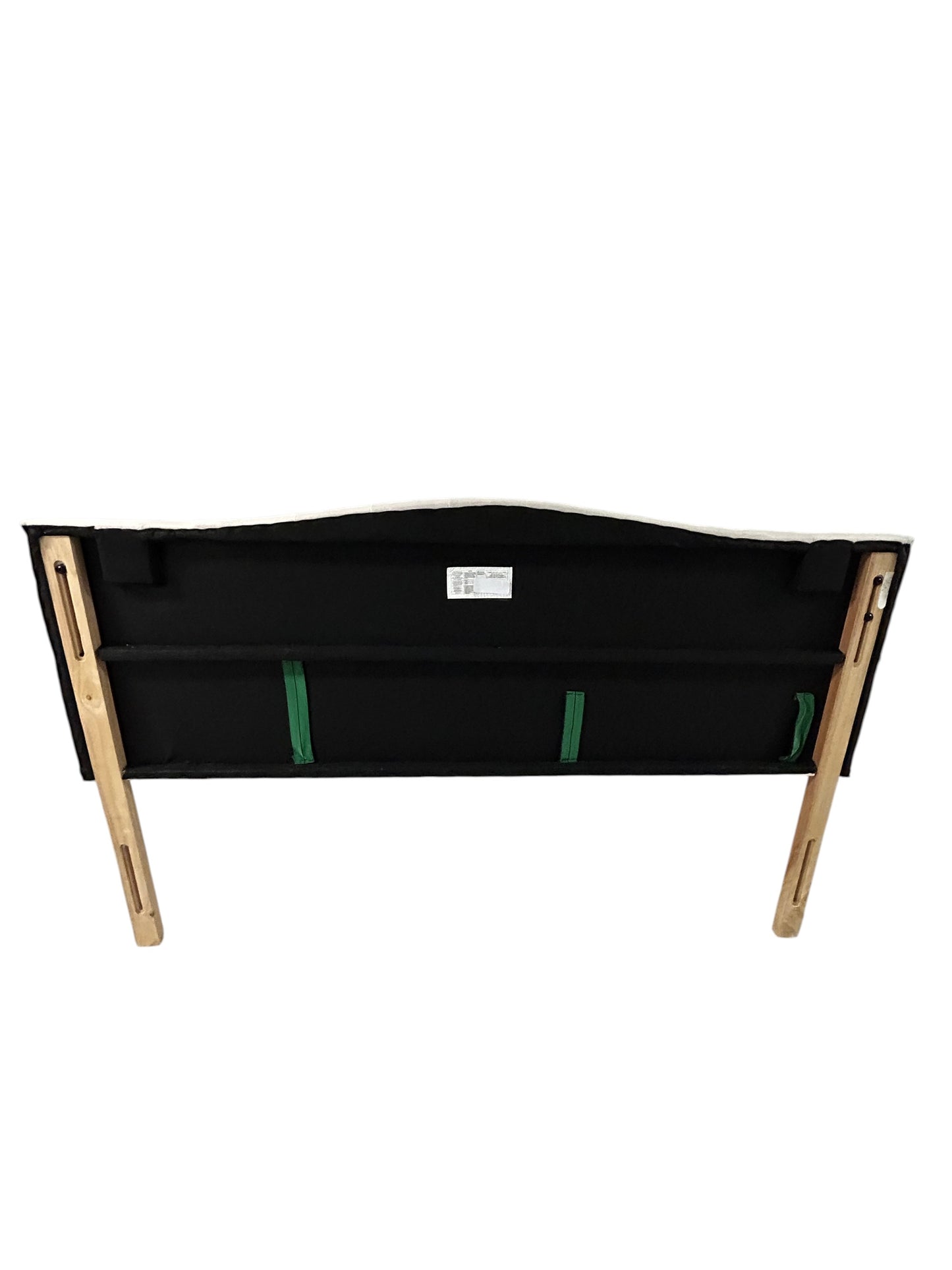 Beige queen upholstered tufted headboard with button detailing and wooden legs.