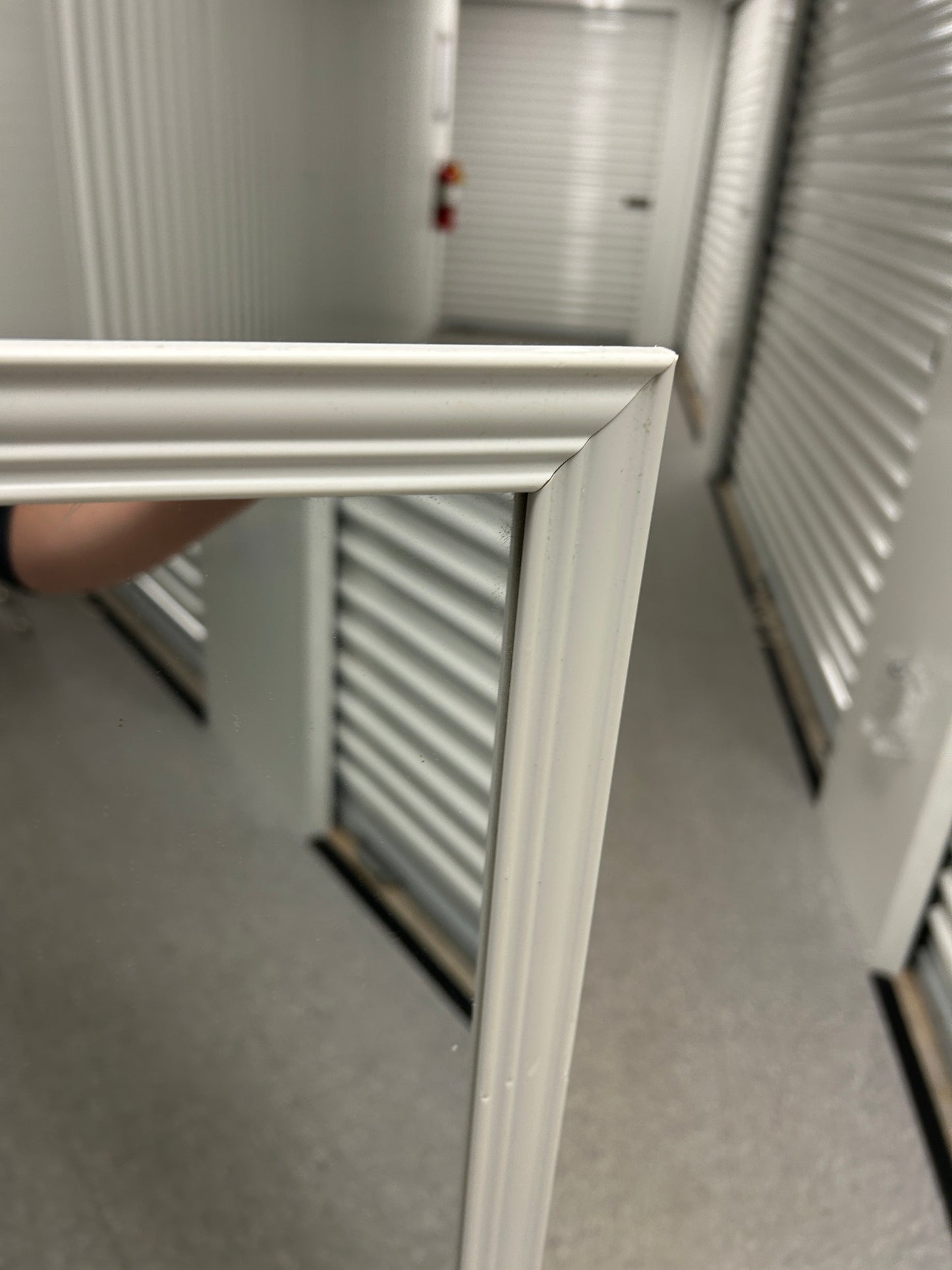 Target full-length standing floor mirror with a white frame.