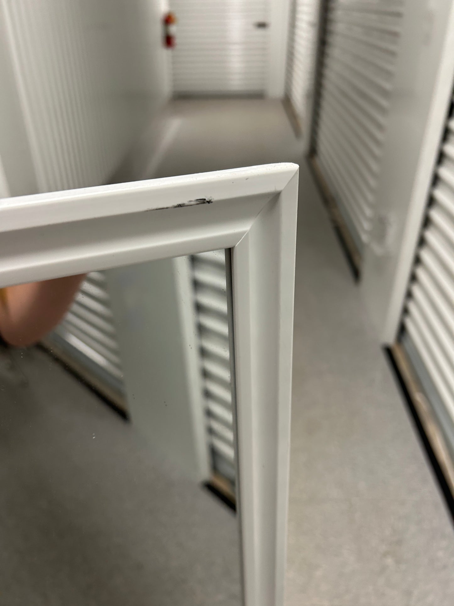 Target full-length standing floor mirror with a white frame.