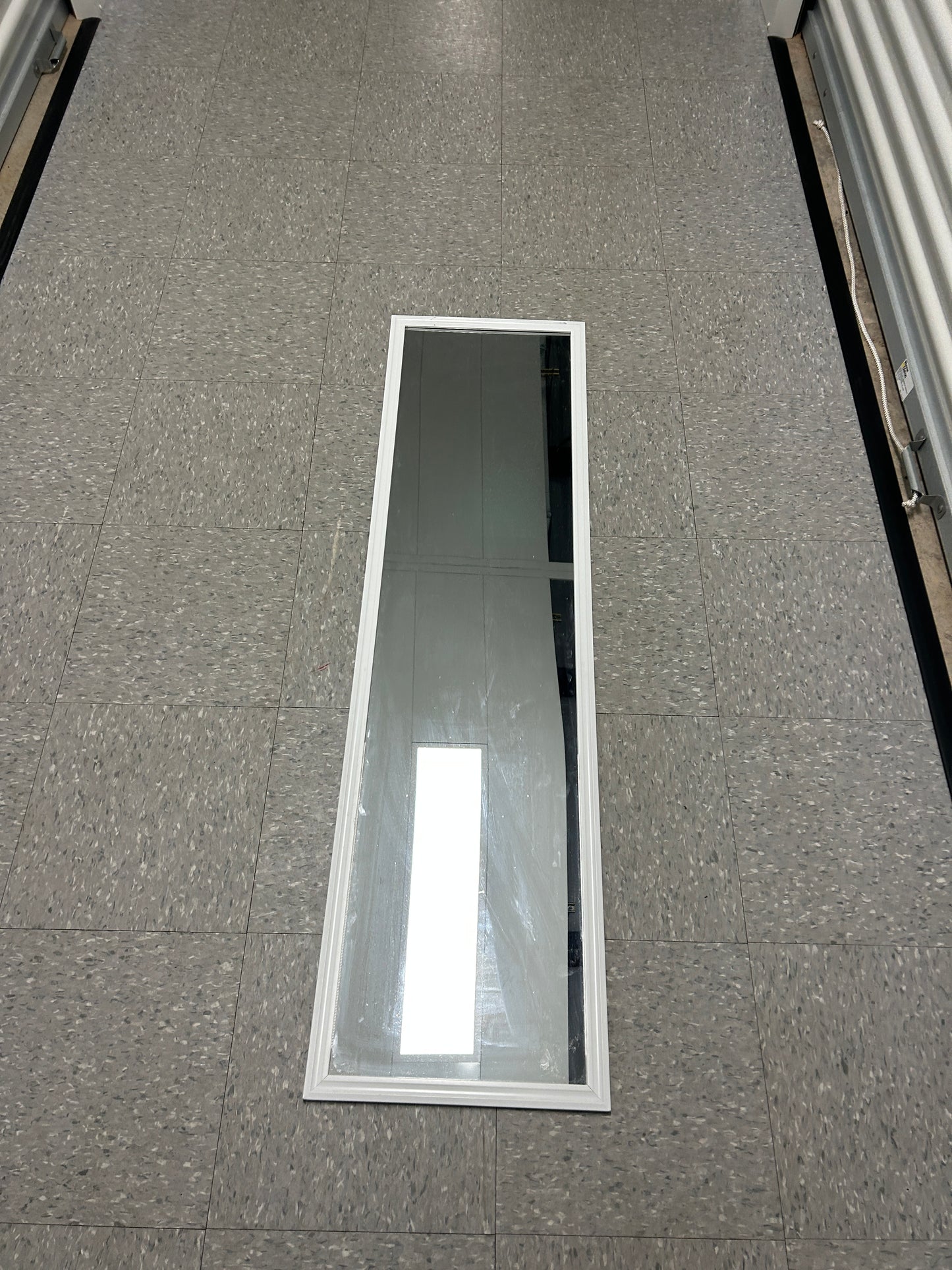 Target full-length standing floor mirror with a white frame.