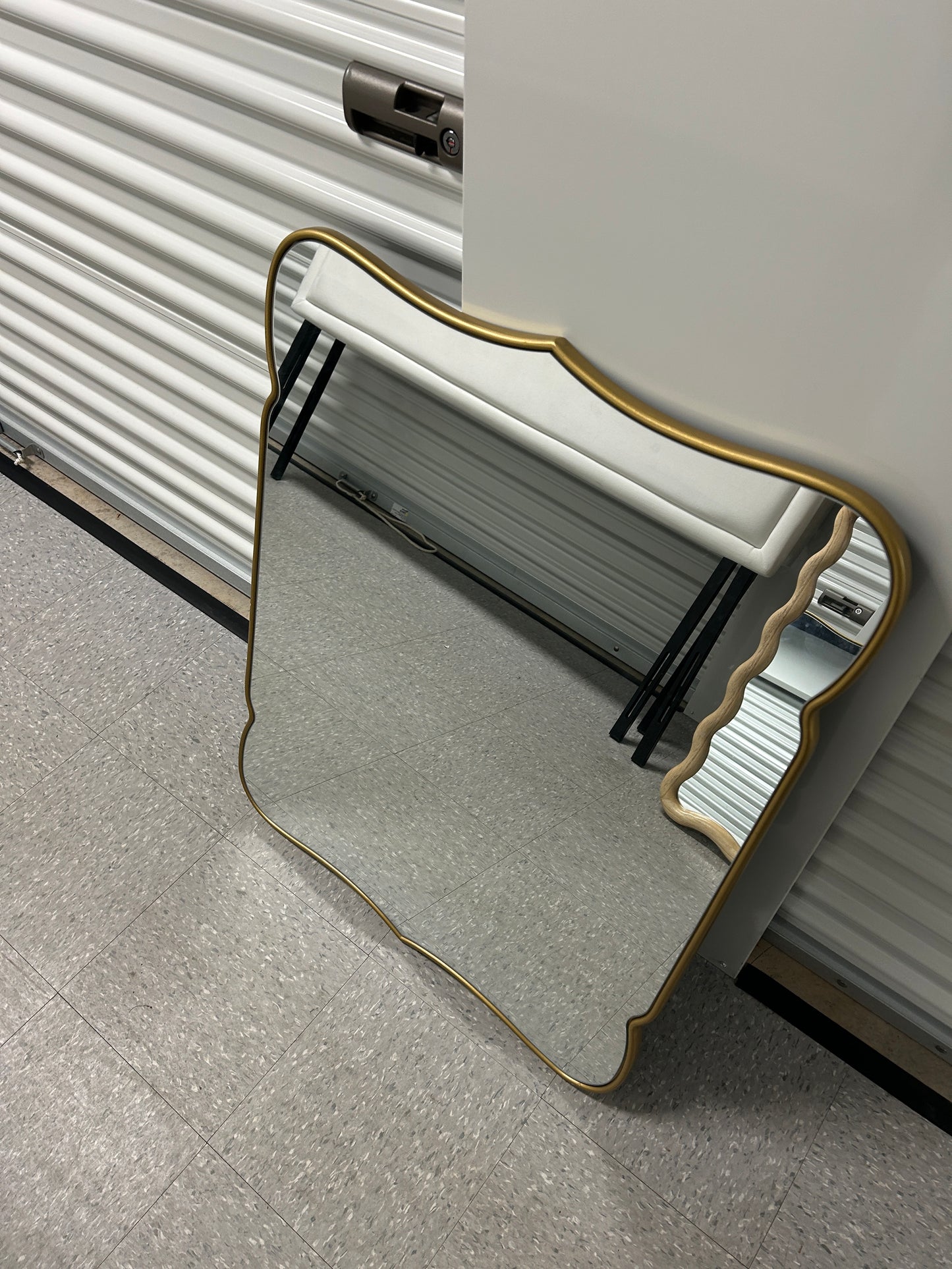Hobby Lobby gold scalloped wall mirror.