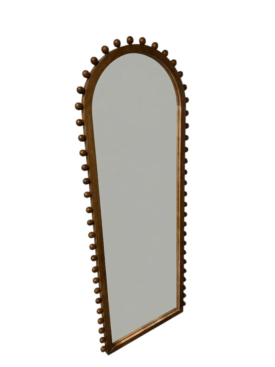 Target arched full-length floor mirror with wooden beaded edges.