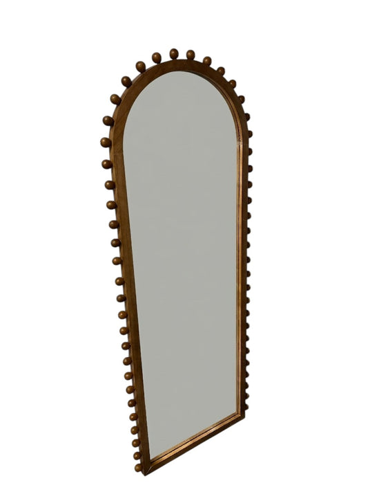 Target arched full-length floor mirror with wooden beaded edges.