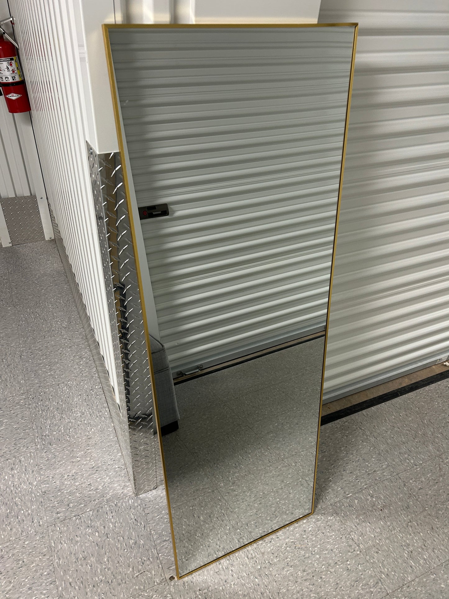 Wayfair full-length rectangular floor mirror with a gold metal frame.