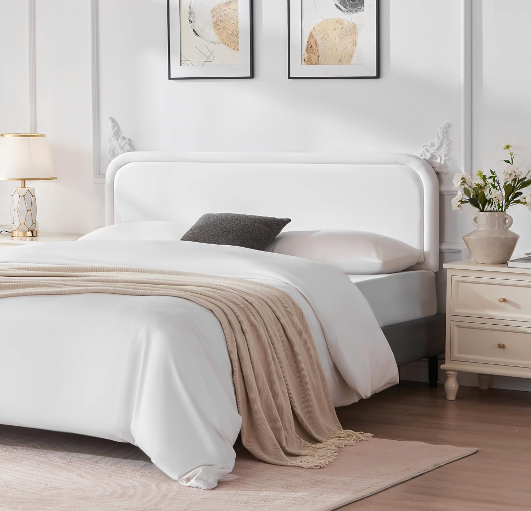 White queen velvet headboard with black metal legs.