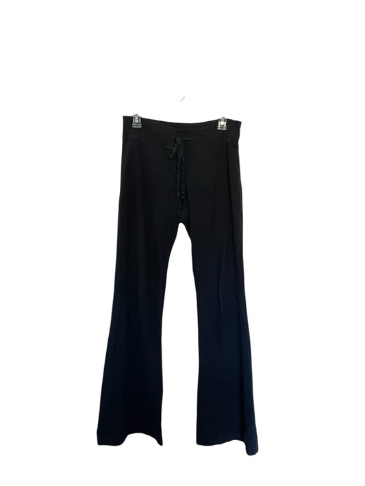 Black drawstring yoga/sweatpants with a wide waistband and flared leg opening.